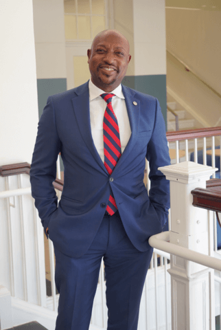 Interim Dean Scott Jackson Dantley, Ph.D. standing and smiling